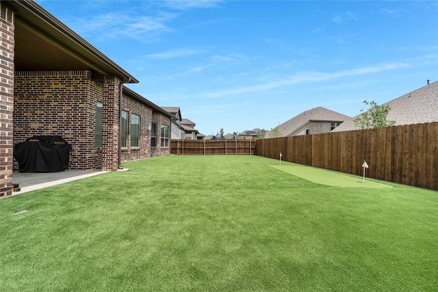 2507 Henley Way, Mansfield, TX 76084 - fenced backyard with a putting green