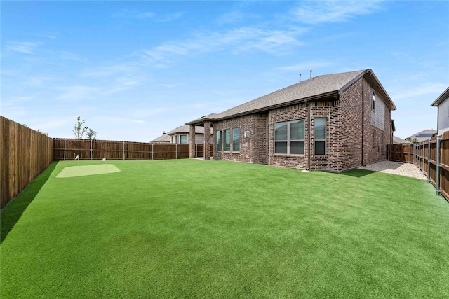 2507 Henley Way, Mansfield, TX 76084 - fenced backyard featuring an area to practice putting