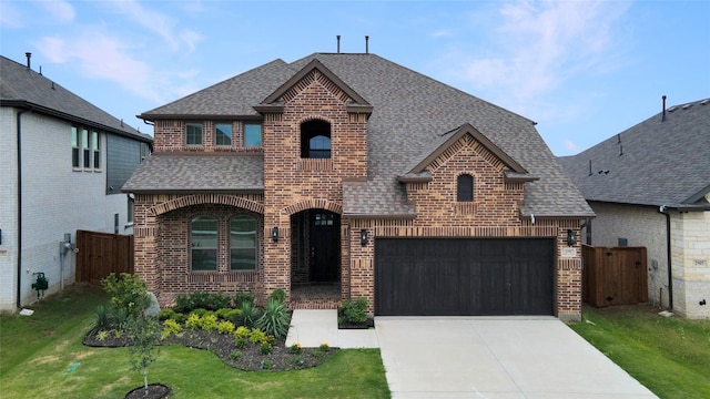 2507 Henley Way, Mansfield, TX 76084 - french provincial home with roof with shingles, brick siding, concrete driveway, and a gate