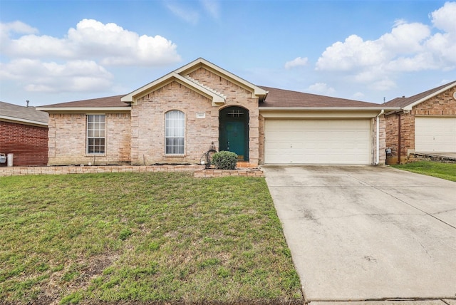 ranch-style house with an attached garage, concrete driveway, a front yard, and a shingled roof