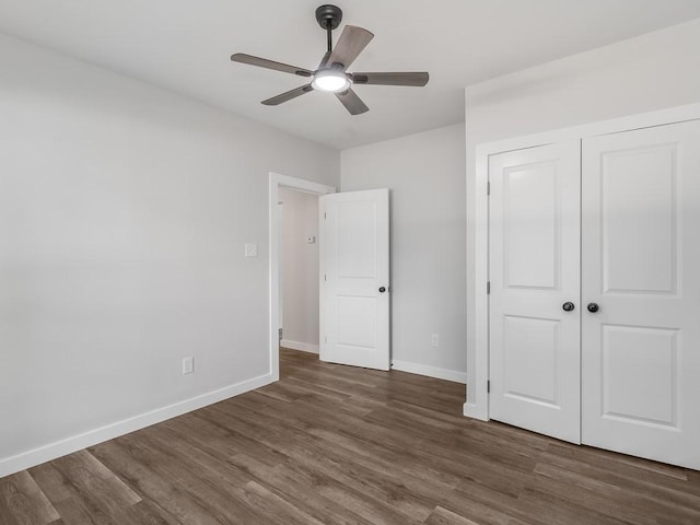 610 SW 3rd St, Kerens, TX 75144 - unfurnished bedroom with wood finished floors, baseboards, a closet, and a ceiling fan