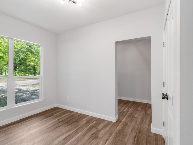 610 SW 3rd St, Kerens, TX 75144 - spare room featuring wood finished floors and baseboards