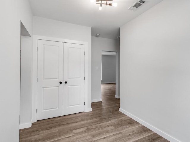 610 SW 3rd St, Kerens, TX 75144 - unfurnished bedroom featuring a closet, wood finished floors, and baseboards