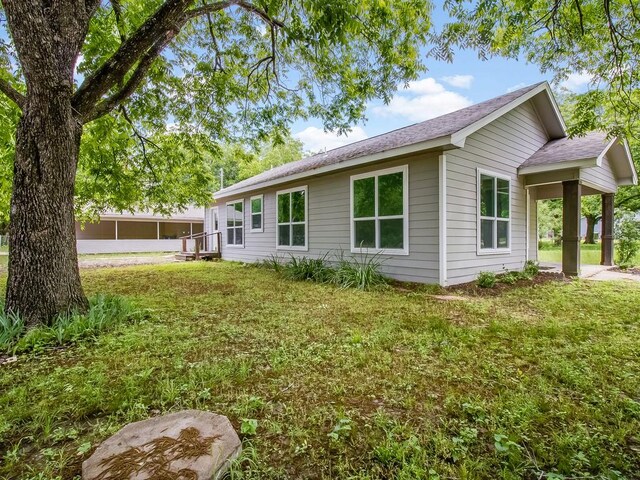 610 SW 3rd St, Kerens, TX 75144 - view of side of home featuring a yard and a shingled roof