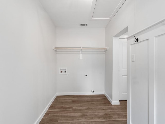 610 SW 3rd St, Kerens, TX 75144 - clothes washing area featuring hookup for an electric dryer, wood finished floors, washer hookup, and baseboards