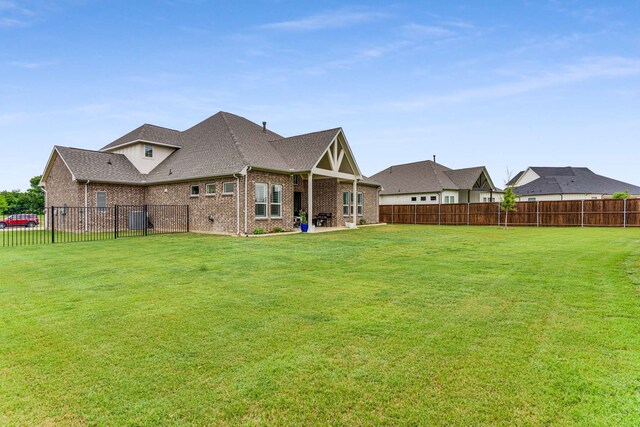 175 Stirling Dr, Argyle, TX 76226 - rear view of property featuring brick siding and roof with shingles