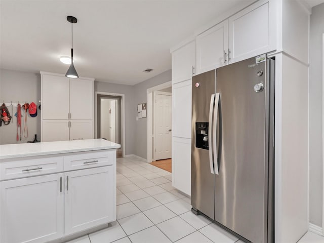 2626 Rivercrest Dr, Arlington, TX 76006 - kitchen with stainless steel fridge with ice dispenser, white cabinetry, light countertops, and light tile patterned floors