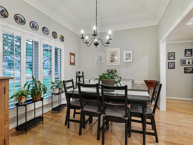 2626 Rivercrest Dr, Arlington, TX 76006 - dining room featuring a chandelier, light wood finished floors, ornamental molding, and baseboards