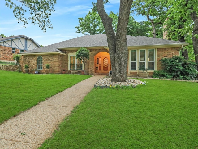 2626 Rivercrest Dr, Arlington, TX 76006 - view of front of house with brick siding, a front lawn, and roof with shingles