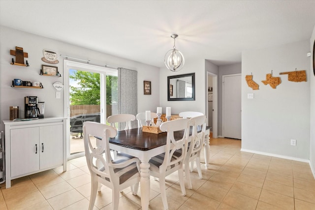 240 Willow Creek Ln, Terrell, TX 75160 - dining room featuring a chandelier, light tile patterned floors, and baseboards