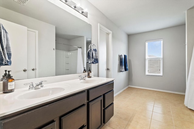 240 Willow Creek Ln, Terrell, TX 75160 - full bath with baseboards, a shower with curtain, tile patterned flooring, and double vanity