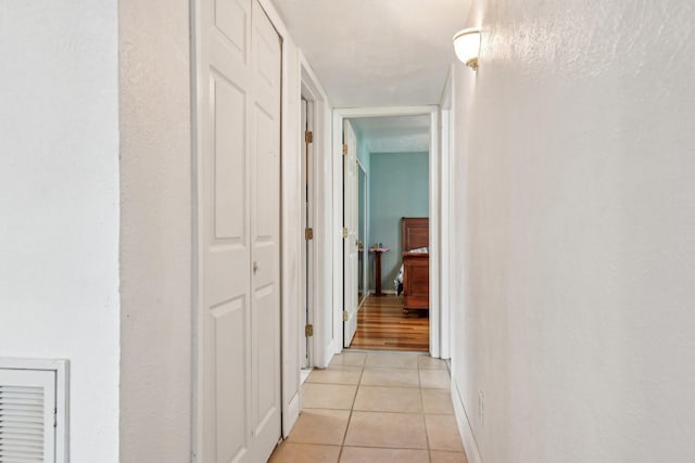 7600 Independence Dr, The Colony, TX 75056 - hallway with light tile patterned floors and baseboards