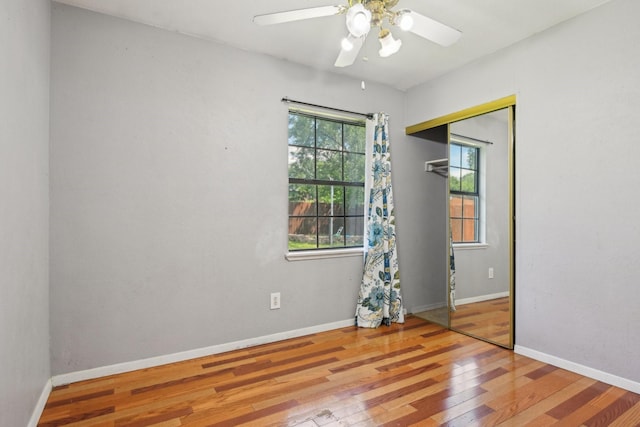 7600 Independence Dr, The Colony, TX 75056 - spare room with wood finished floors, a ceiling fan, and baseboards