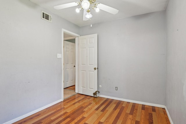 7600 Independence Dr, The Colony, TX 75056 - empty room with ceiling fan, wood finished floors, and baseboards