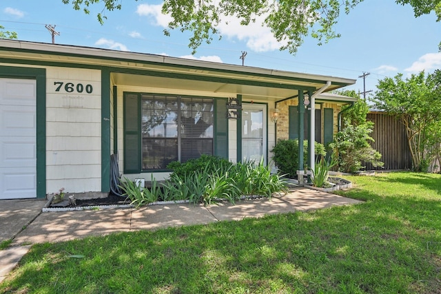 7600 Independence Dr, The Colony, TX 75056 - rear view of property featuring a lawn