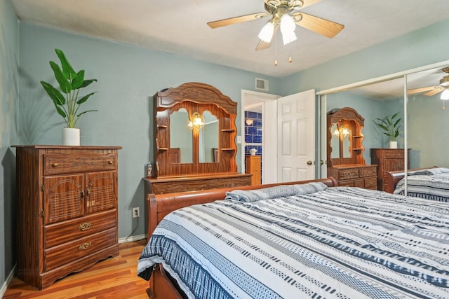 7600 Independence Dr, The Colony, TX 75056 - bedroom featuring light wood-style floors, baseboards, a closet, and ceiling fan