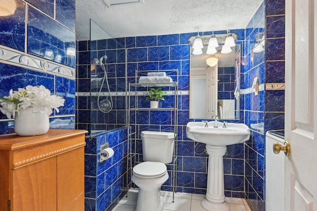 7600 Independence Dr, The Colony, TX 75056 - bathroom with tile walls, tile patterned flooring, and toilet
