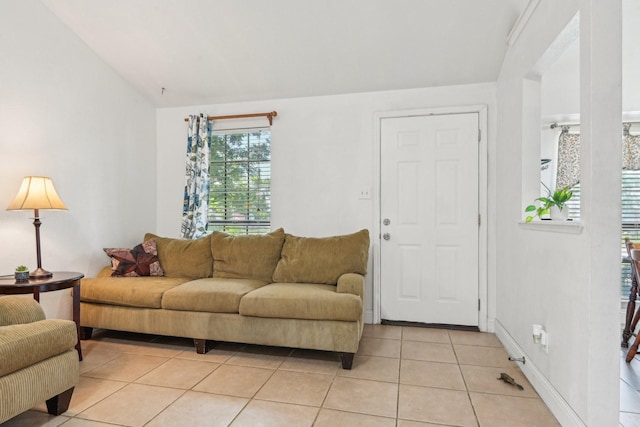 7600 Independence Dr, The Colony, TX 75056 - living room with light tile patterned flooring, lofted ceiling, and baseboards