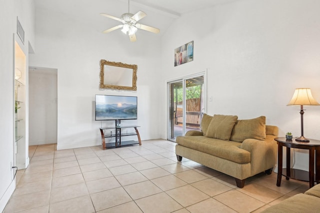 7600 Independence Dr, The Colony, TX 75056 - living area with high vaulted ceiling, light tile patterned flooring, ceiling fan, and baseboards