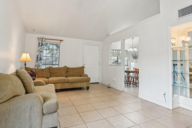 7600 Independence Dr, The Colony, TX 75056 - living area featuring a chandelier, light tile patterned floors, lofted ceiling, and baseboards