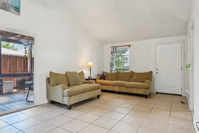 7600 Independence Dr, The Colony, TX 75056 - living room with light tile patterned flooring, high vaulted ceiling, and baseboards