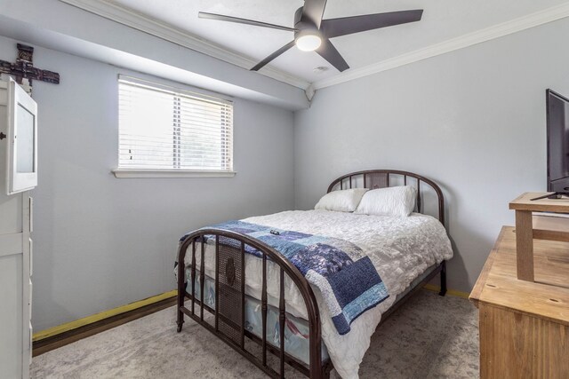 carpeted bedroom with ornamental molding, baseboards, a ceiling fan, and electric panel