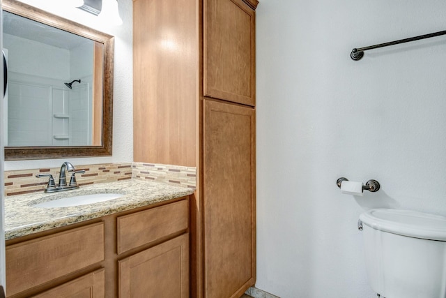 12480 Abrams Rd Unit 2801, Dallas, TX 75243 - full bath with toilet, vanity, backsplash, and a shower