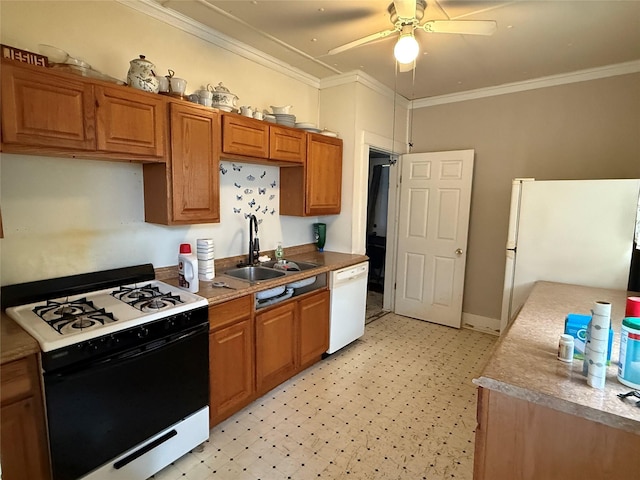 kitchen featuring white appliances, crown molding, light floors, ceiling fan, and a sink