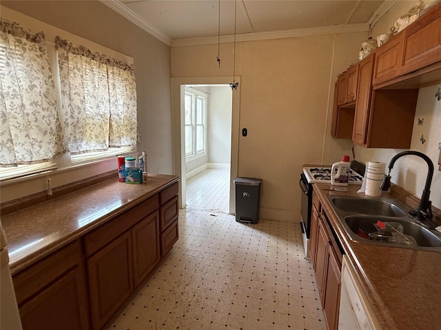 kitchen with a sink, gas range, white dishwasher, crown molding, and light floors