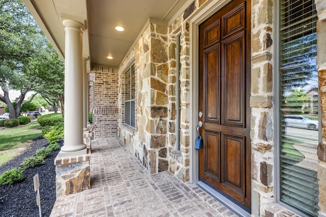 3455 Crosshaven Ln, Frisco, TX 75033 - doorway to property featuring a porch and stone siding