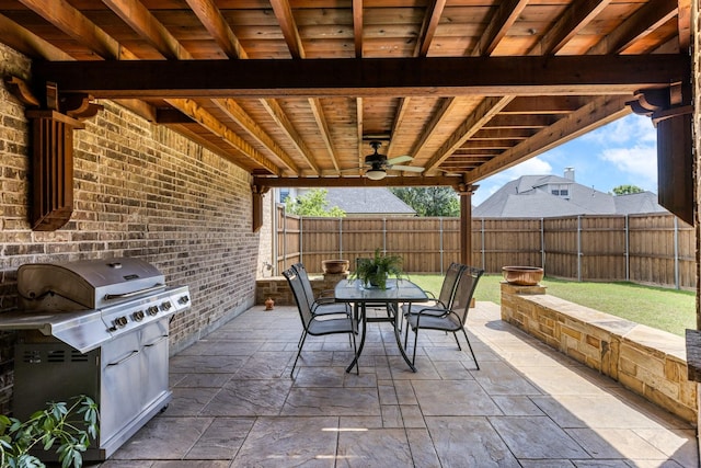 3455 Crosshaven Ln, Frisco, TX 75033 - fenced backyard featuring outdoor dining area, a ceiling fan, a patio, and area for grilling