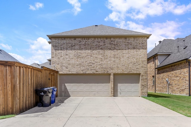 3455 Crosshaven Ln, Frisco, TX 75033 - view of side of home featuring brick siding, concrete driveway, a garage, and roof with shingles