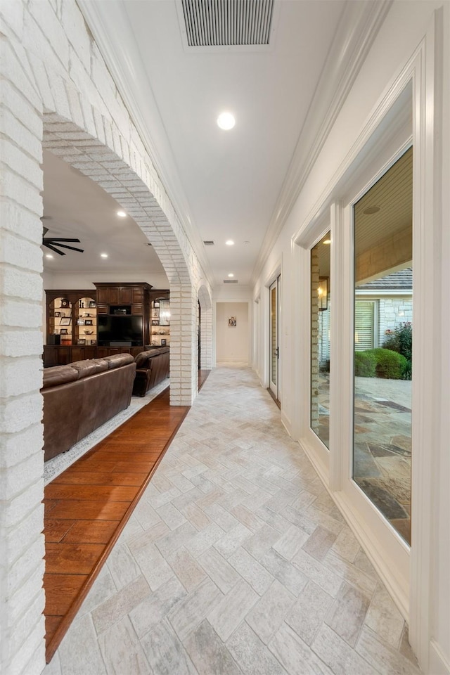 1020 Canyon Trl, Waco, TX 76657 - hall with arched walkways, recessed lighting, baseboards, and crown molding