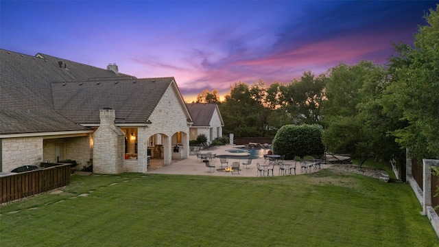 1020 Canyon Trl, Waco, TX 76657 - back of property featuring stone siding, a patio, and a chimney