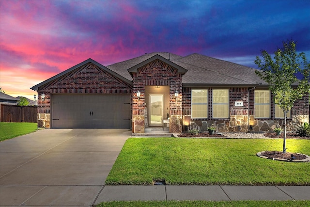 223 Exploration Way, Fate, TX 75189 - view of front facade with driveway, brick siding, and a garage