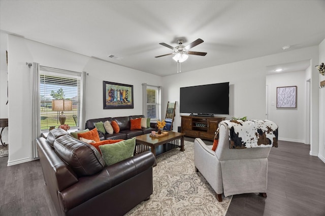 223 Exploration Way, Fate, TX 75189 - living area featuring wood finished floors, ceiling fan, and baseboards