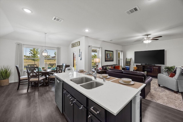 223 Exploration Way, Fate, TX 75189 - kitchen featuring a sink, dishwasher, light countertops, open floor plan, and lofted ceiling