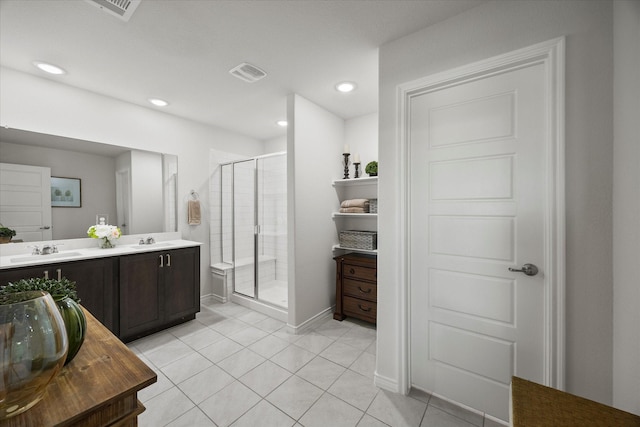 223 Exploration Way, Fate, TX 75189 - full bath with a stall shower, double vanity, tile patterned flooring, recessed lighting, and baseboards