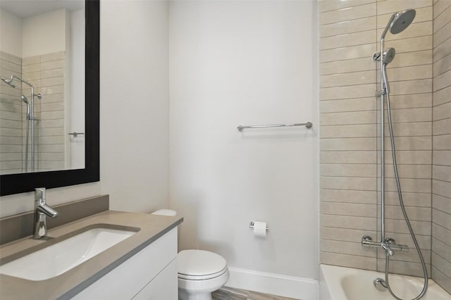 full bath with toilet, vanity, shower / washtub combination, baseboards, and wood finished floors