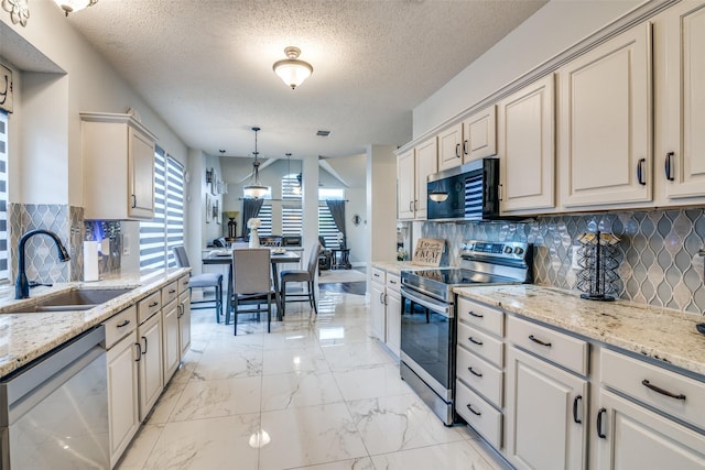 1407 Hickory Bend Dr, Allen, TX 75002 - kitchen featuring appliances with stainless steel finishes, a sink, light marble finish flooring, decorative backsplash, and decorative light fixtures