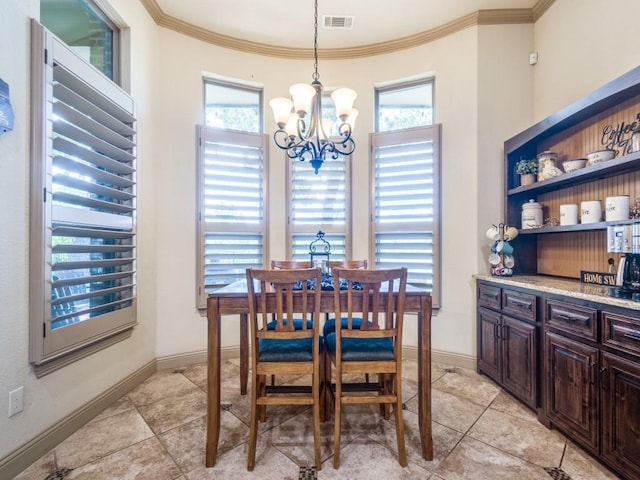 dining space with a chandelier, healthy amount of natural light, crown molding, and light tile patterned floors