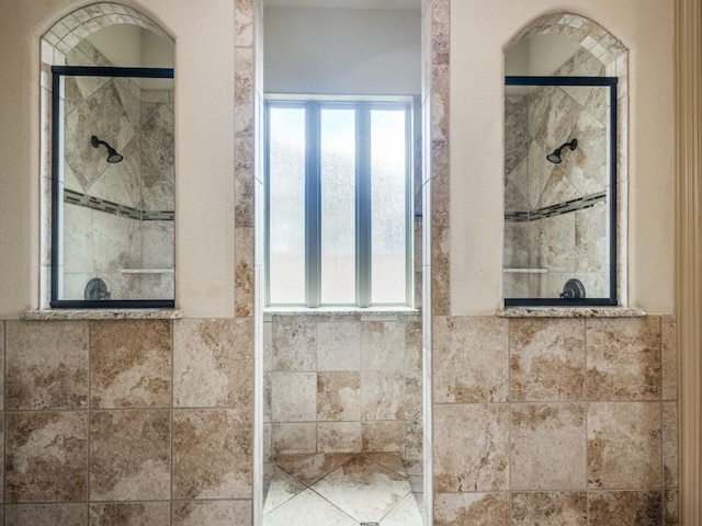 bathroom featuring a shower stall
