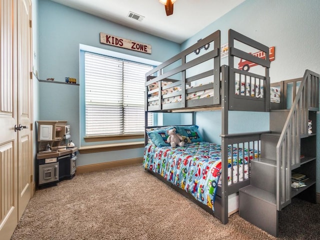 bedroom featuring carpet floors and baseboards