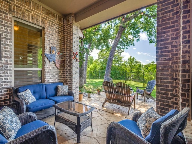 view of patio / terrace with an outdoor hangout area and fence