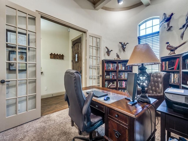 home office with ornamental molding, wood finished floors, beamed ceiling, and baseboards