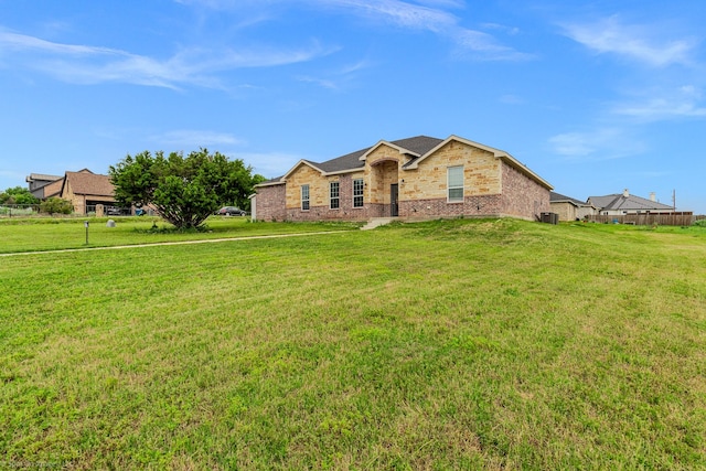 5585 Justine Pl, Fort Worth, TX 76126 - ranch-style house with a front yard and brick siding