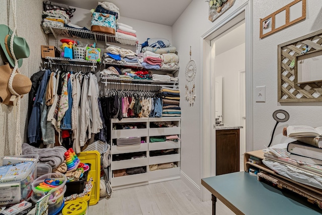 5585 Justine Pl, Fort Worth, TX 76126 - walk in closet featuring wood finished floors
