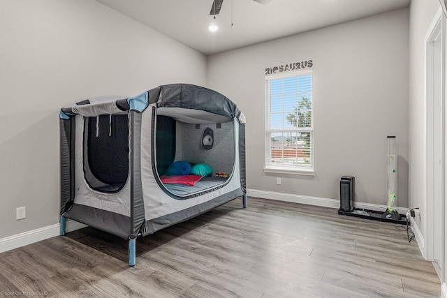 5585 Justine Pl, Fort Worth, TX 76126 - bedroom featuring wood finished floors, baseboards, and ceiling fan