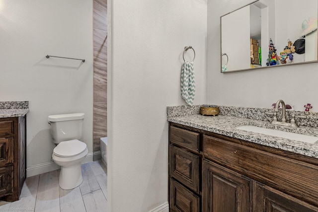 5585 Justine Pl, Fort Worth, TX 76126 - bathroom featuring vanity, toilet, baseboards, and wood finished floors