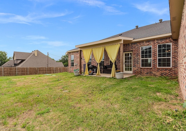 5585 Justine Pl, Fort Worth, TX 76126 - back of property featuring brick siding and a patio area